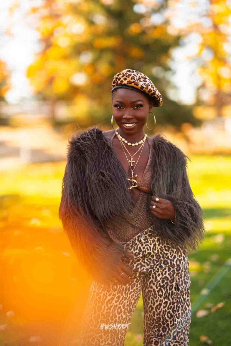 Fashion portrait with leopard print beret and warm autumn background at Spruce Meadows Calgary